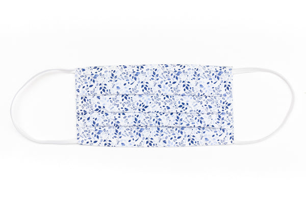 White mask with blue leaves