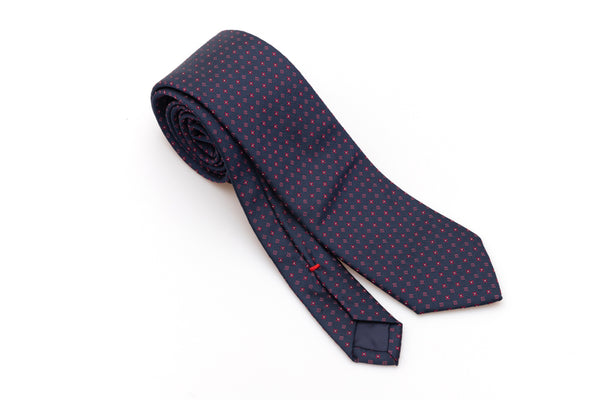 Blue tie with geometric pattern in pure silk