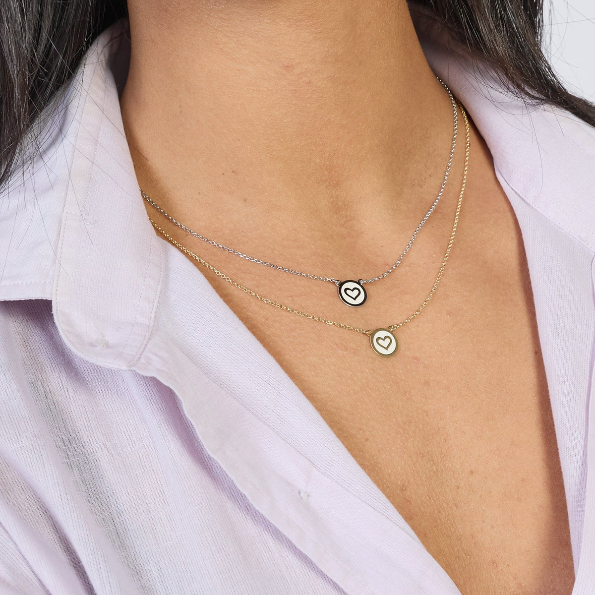 Rhodium-plated silver necklace with heart disc centerpiece