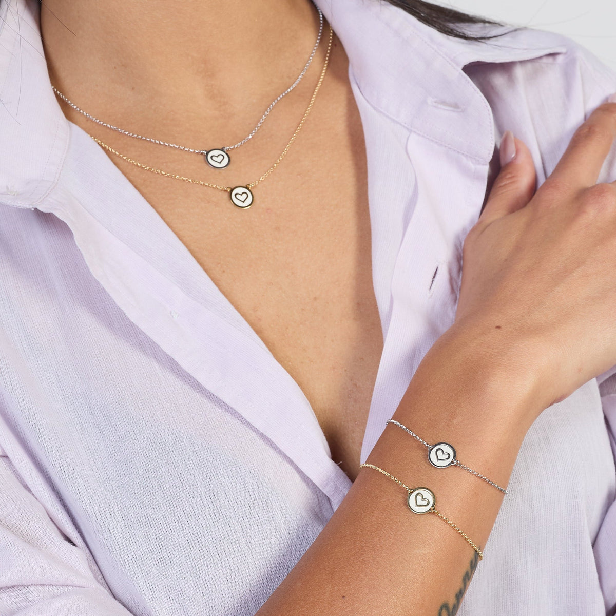 Rhodium-plated silver necklace with heart disc centerpiece