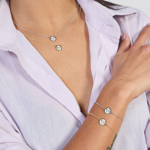 Rhodium-plated silver necklace with heart disc centerpiece