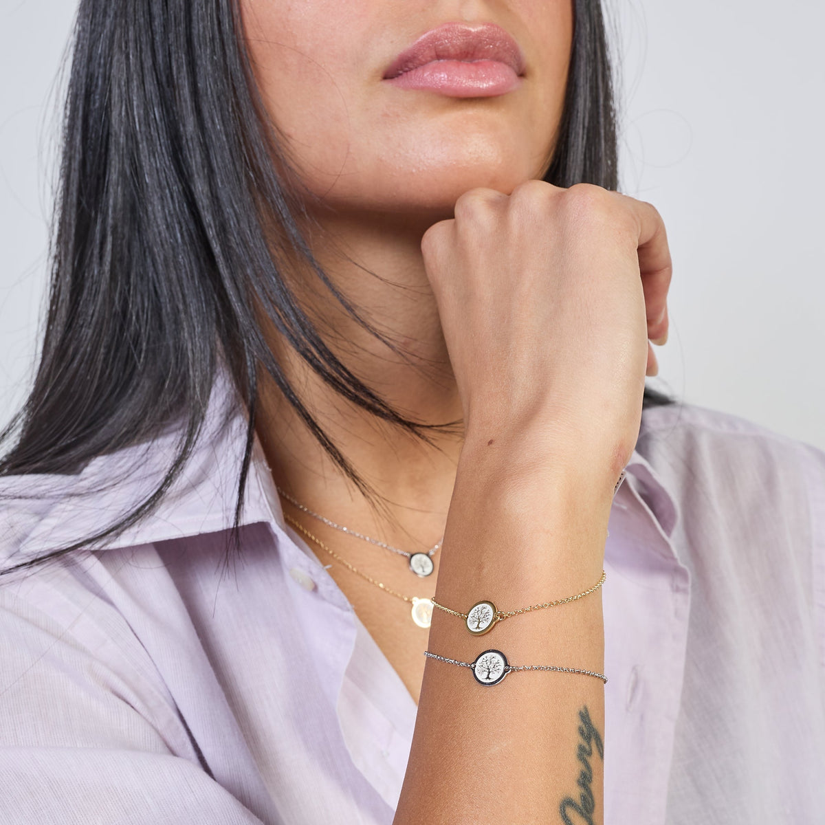 Rhodium-plated silver necklace with central disc featuring the tree of life