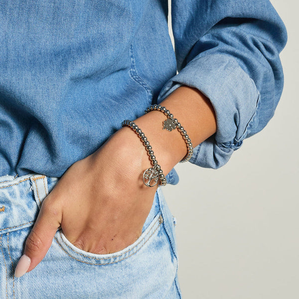 Bracelet in steel with shiny spheres and central pendant tree of life cut-out