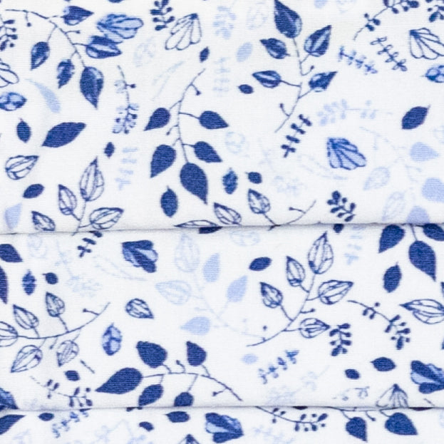 Masque blanc avec des feuilles bleues