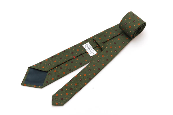 Green tie with geometric pattern in pure silk