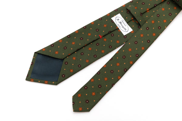 Green tie with geometric pattern in pure silk