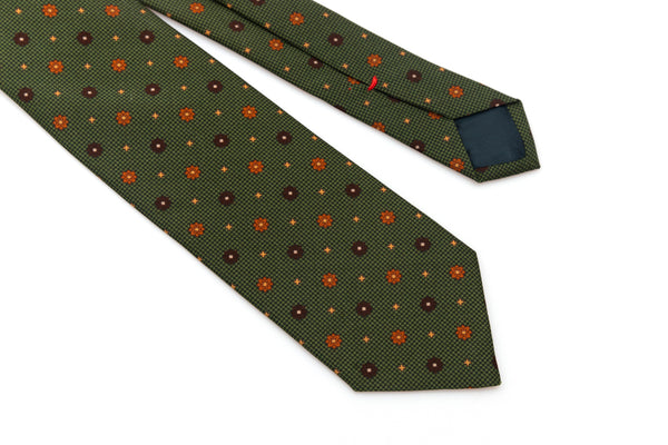 Green tie with geometric pattern in pure silk