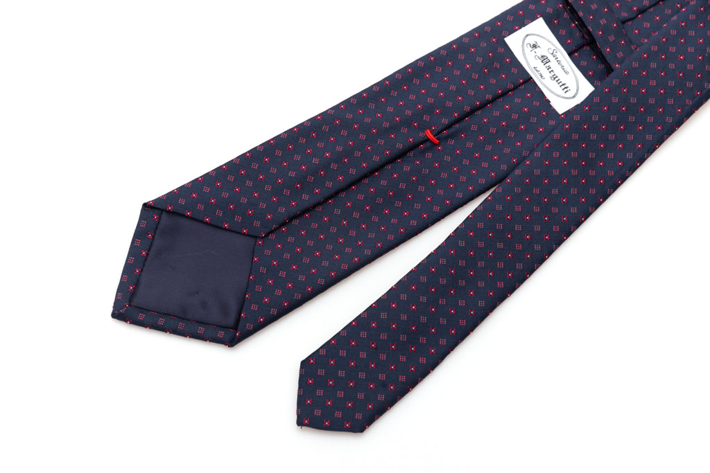 Cravatta blu con geometria in pura seta