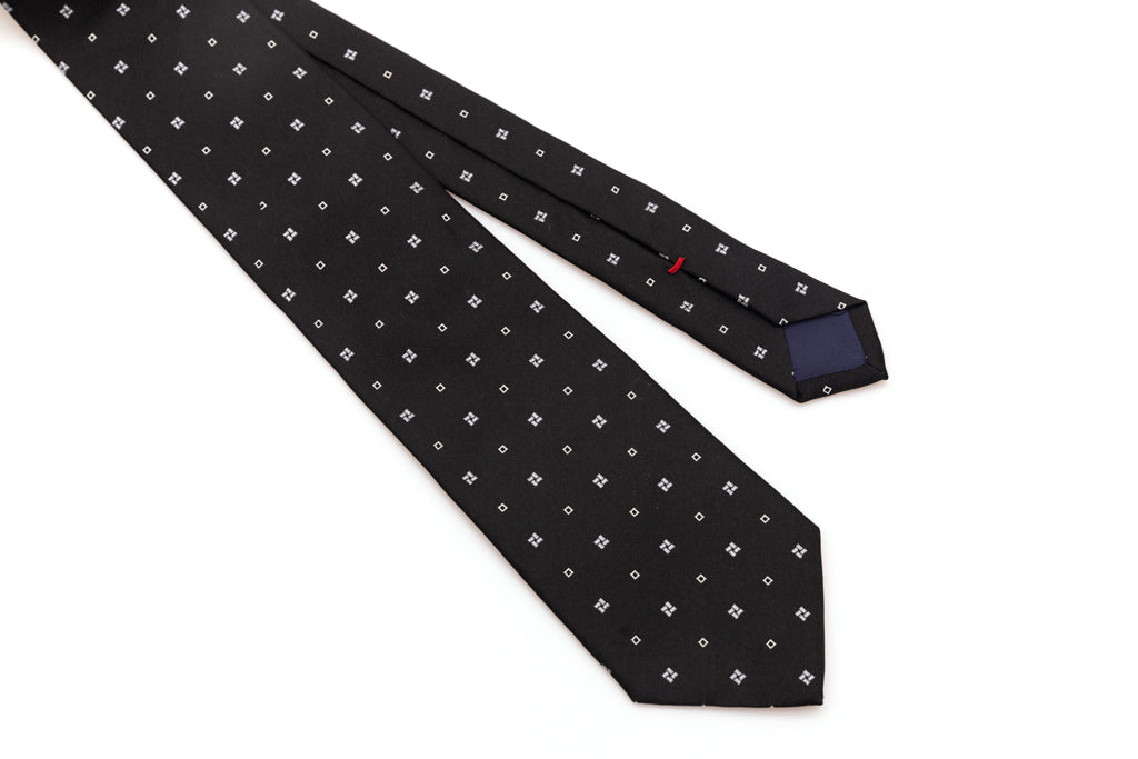 Black tie with white geometry in pure silk