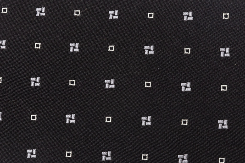 Black tie with white geometry in pure silk