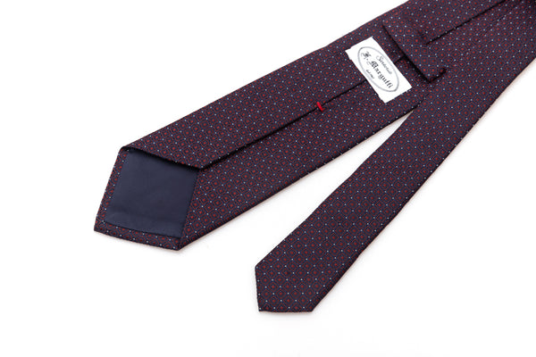 Blue tie with red geometries in pure silk