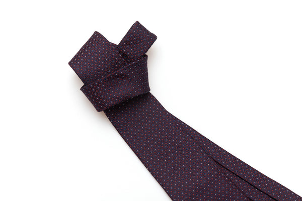 Blue tie with red geometries in pure silk