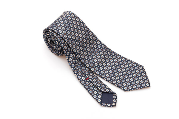 Blue tie with white and light blue geometry in pure silk