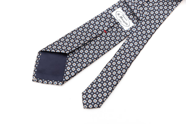 Blue tie with white and light blue geometry in pure silk