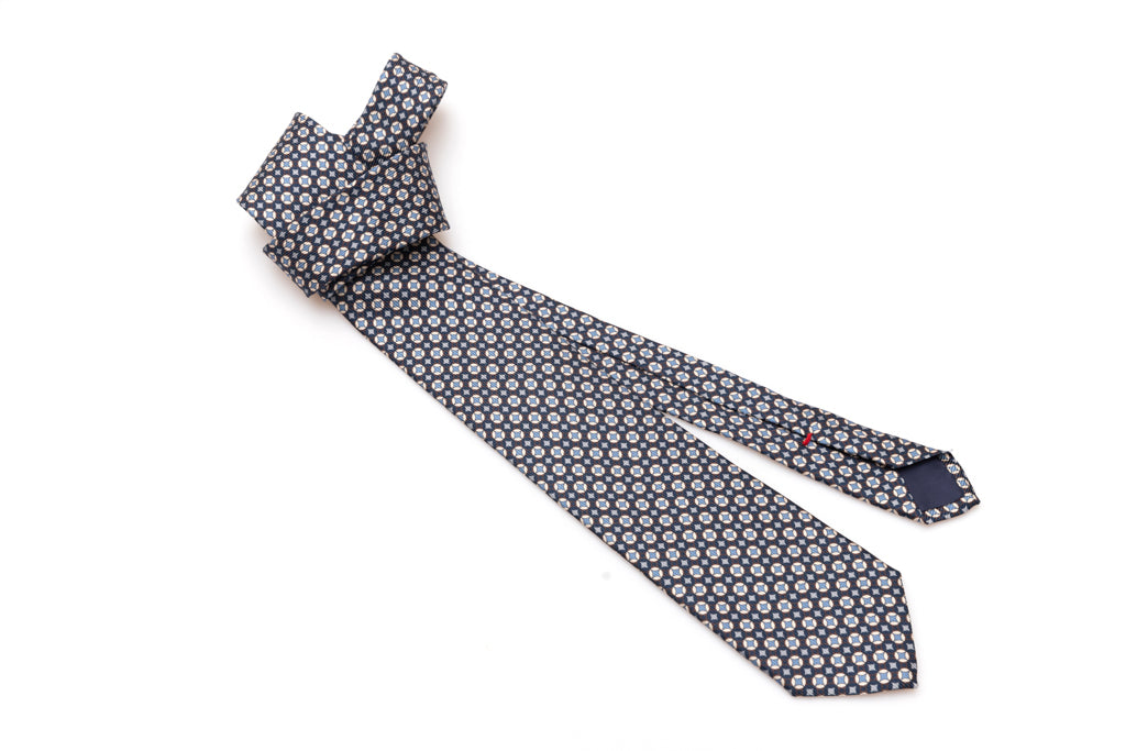 Blue tie with white and light blue geometry in pure silk
