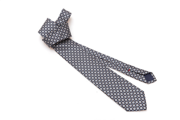 Blue tie with white and light blue geometry in pure silk