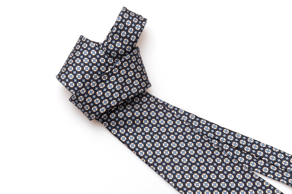 Blue tie with white and light blue geometry in pure silk