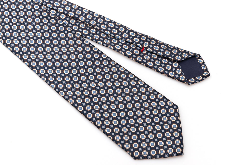 Blue tie with white and light blue geometry in pure silk