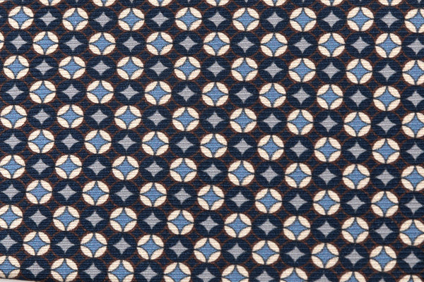 Cravatta blu con geometria bianca e celeste in pura seta