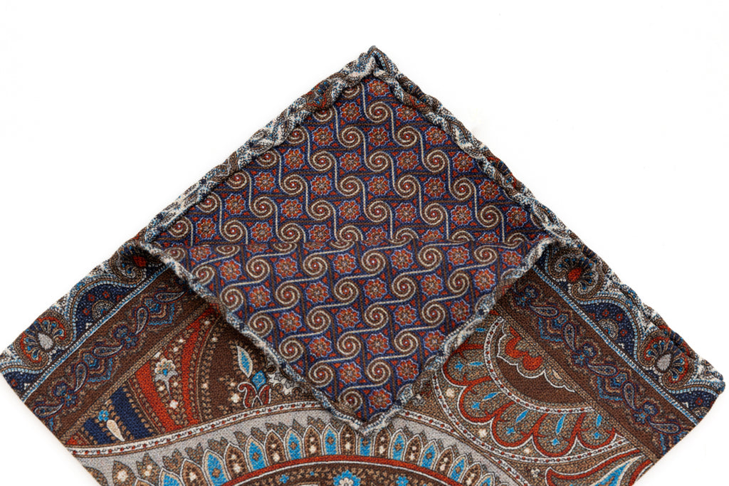 Beige clutch with red and blue pattern in pure silk