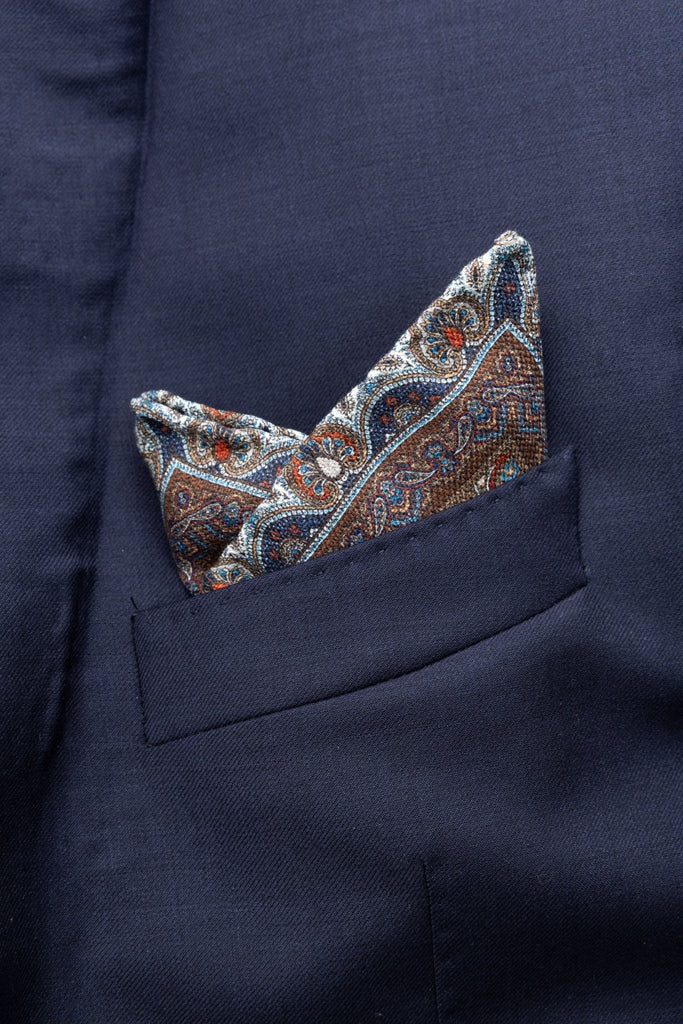 Beige clutch with red and blue pattern in pure silk