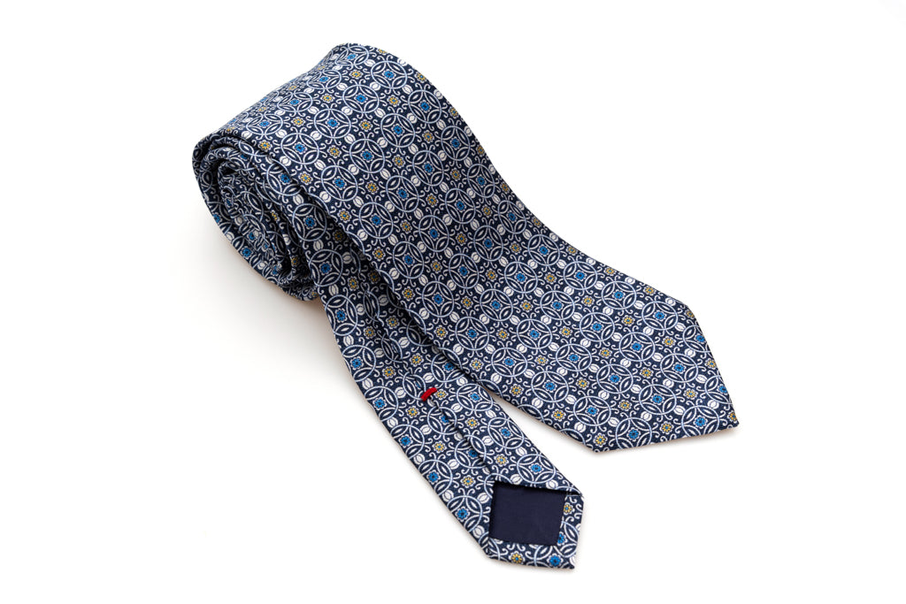 Blue tie with white geometric pattern 100% silk