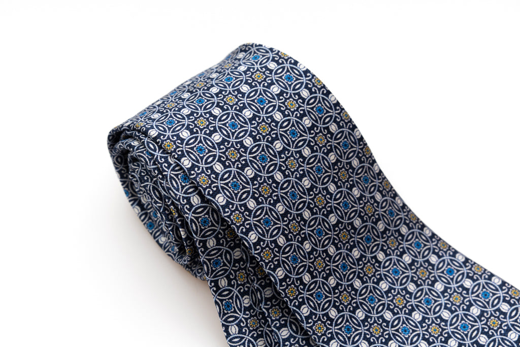 Blue tie with white geometric pattern 100% silk