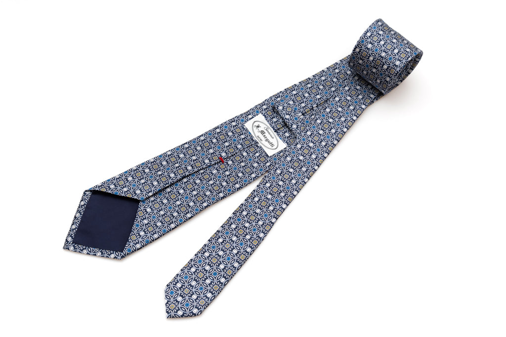 Blue tie with white geometric pattern 100% silk