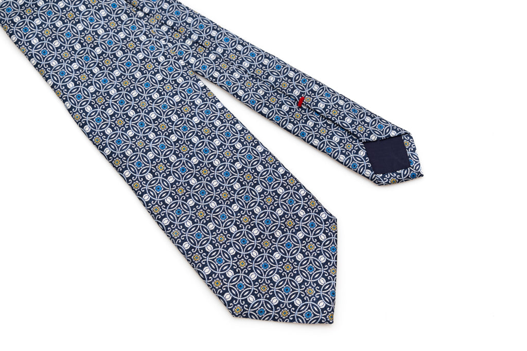 Blue tie with white geometric pattern 100% silk