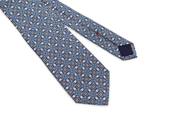Blue tie with white geometric pattern 100% silk