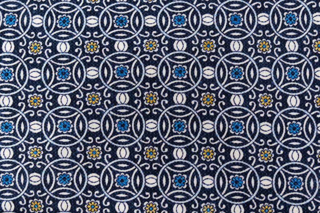 Blue tie with white geometric pattern 100% silk