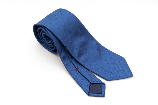 Blue tie with embroidered polka dots in pure silk