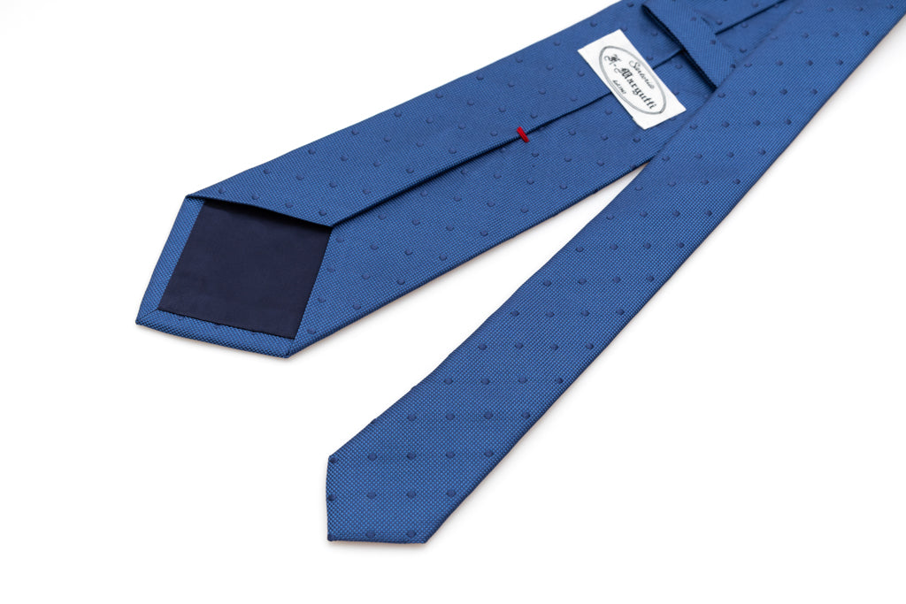 Blue tie with embroidered polka dots in pure silk