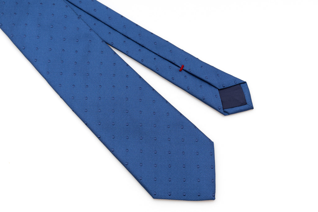 Blue tie with embroidered polka dots in pure silk