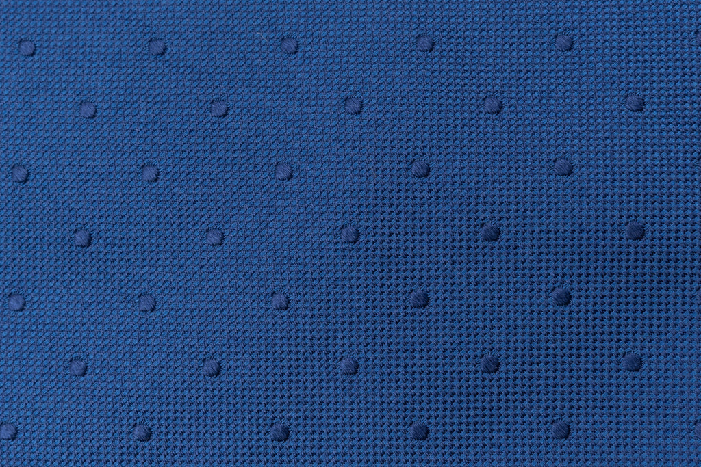 Blue tie with embroidered polka dots in pure silk