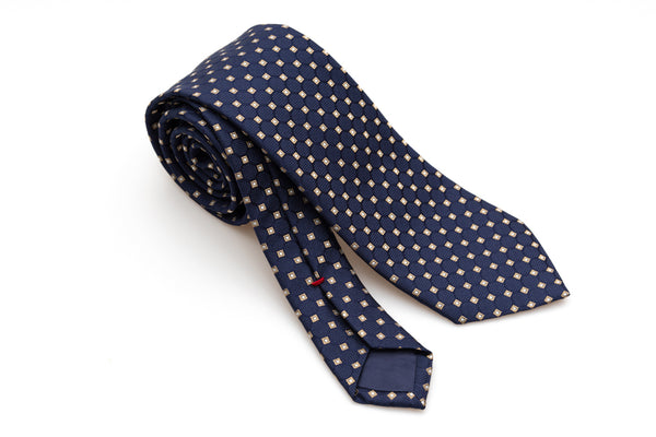 Cravatta blu con geometria beige in pura seta