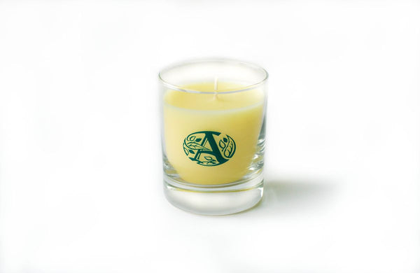 Candela profumata aromatica in vetro bianco