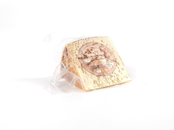 Semi-cured sheep cheese wedge