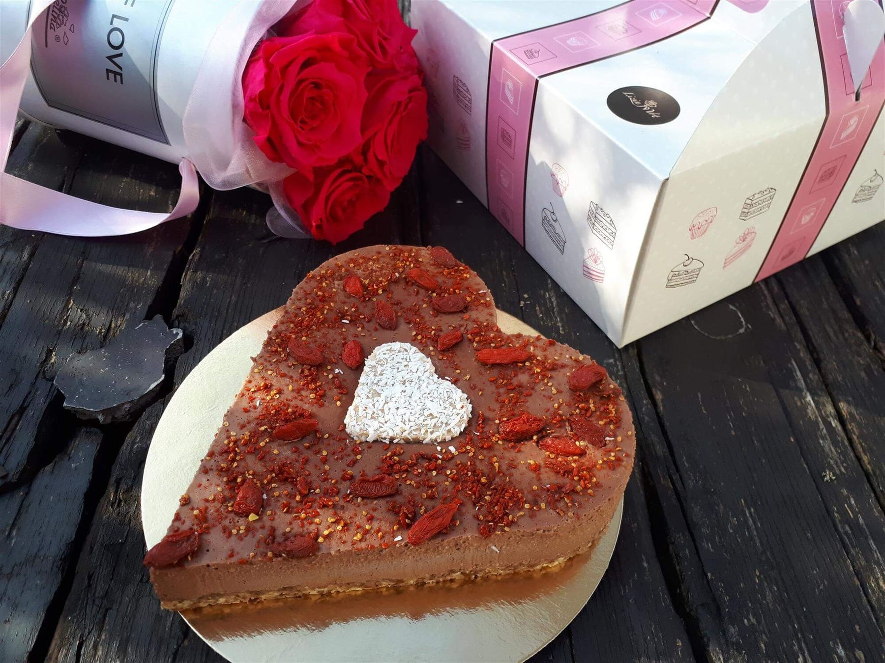 Chocolate heart cake with goji berries topping