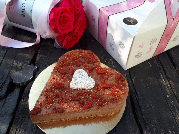 Chocolate heart cake with goji berries topping