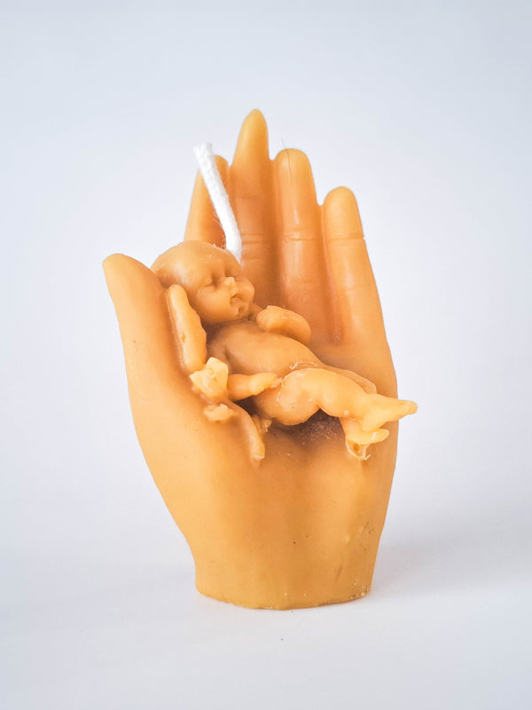 Candle baby in hand