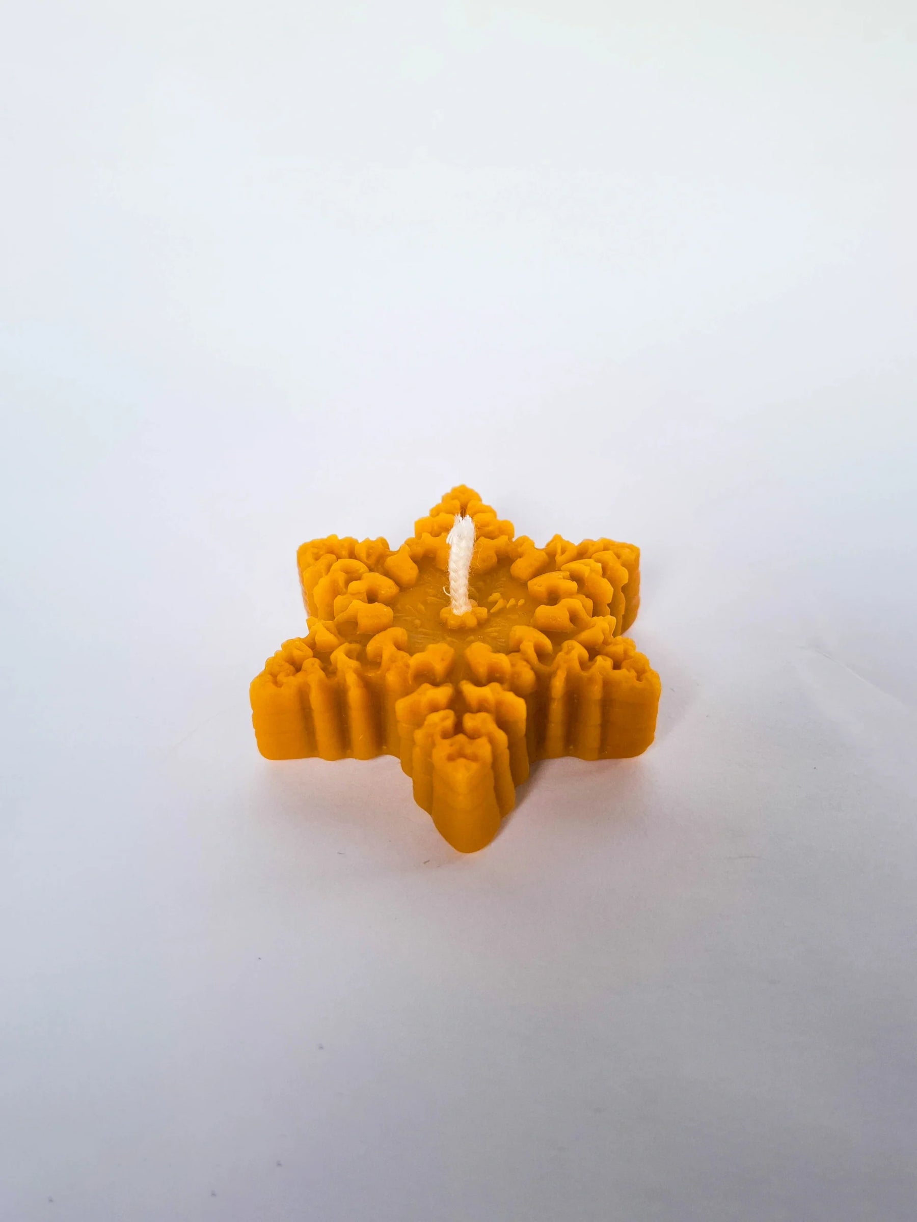 Star-shaped candle in a box