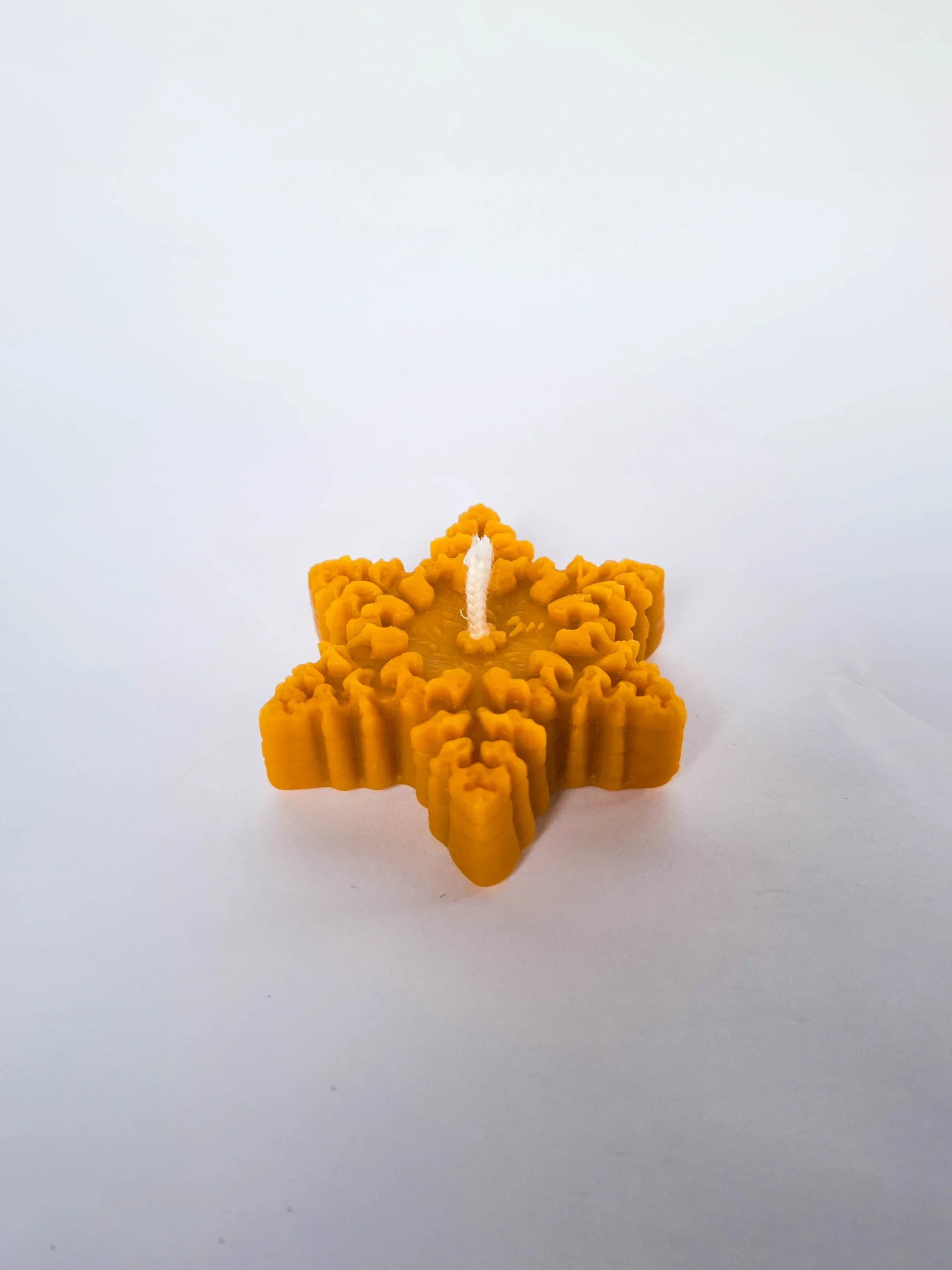 Star-shaped candle in a box