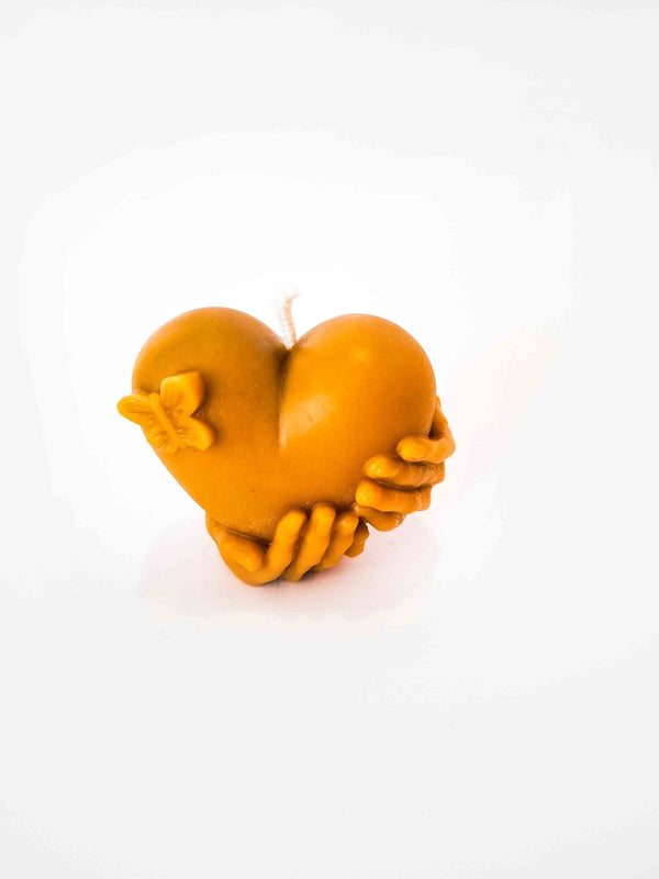 Heart Candle in Hands with Butterfly