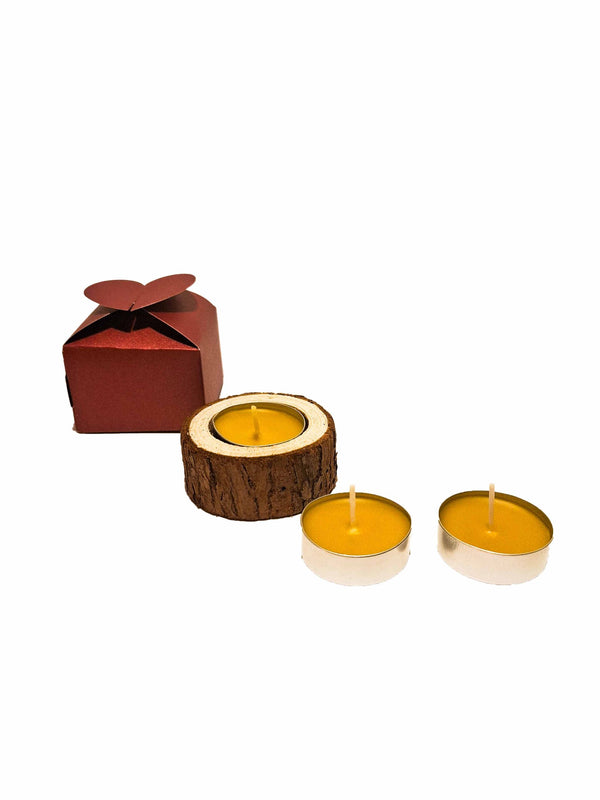 Tea candle in wood in a box