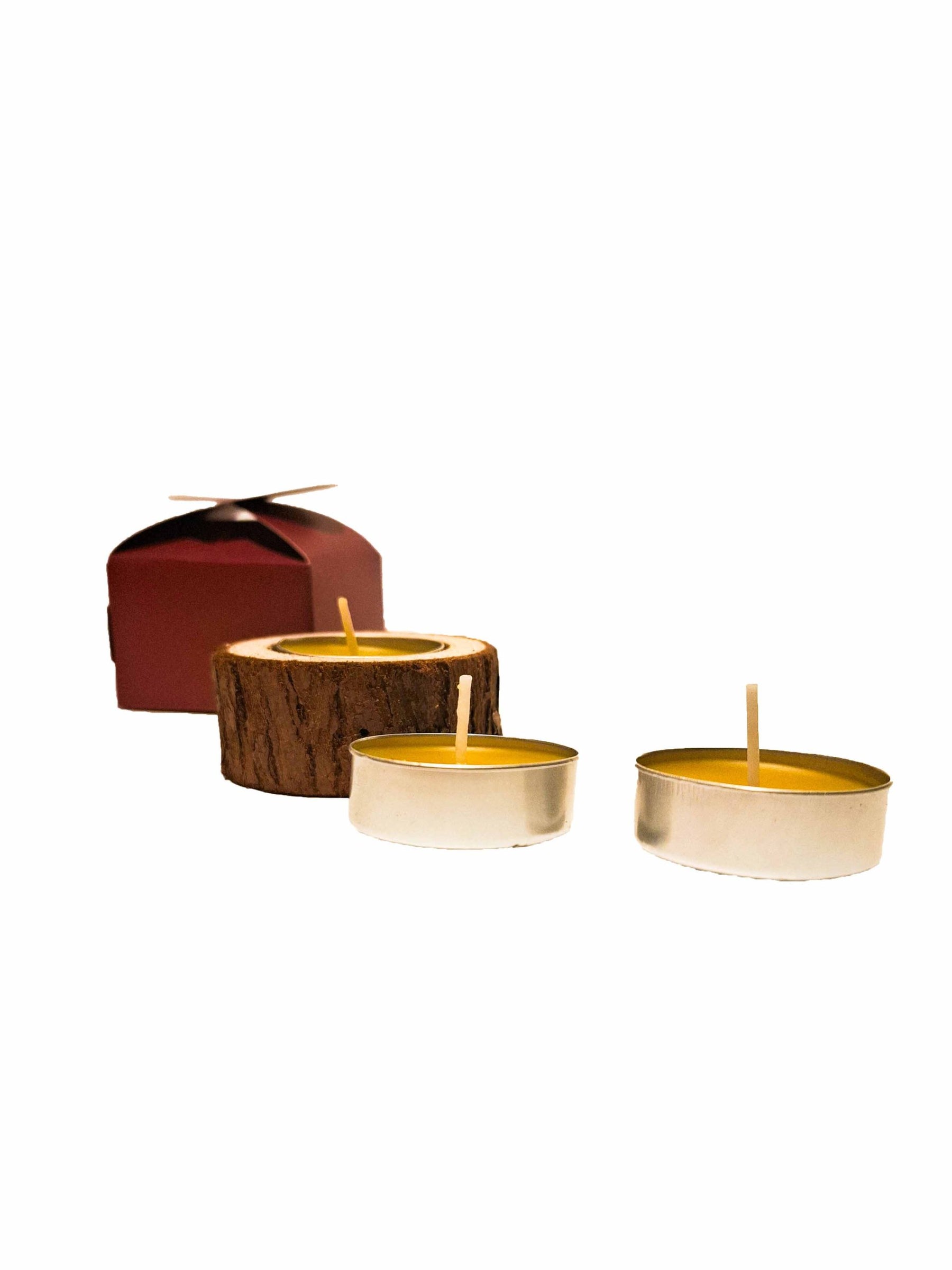 Tea candle in wood in a box