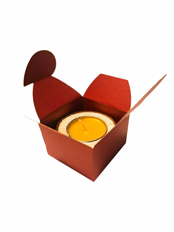 Tea candle in wood in a box