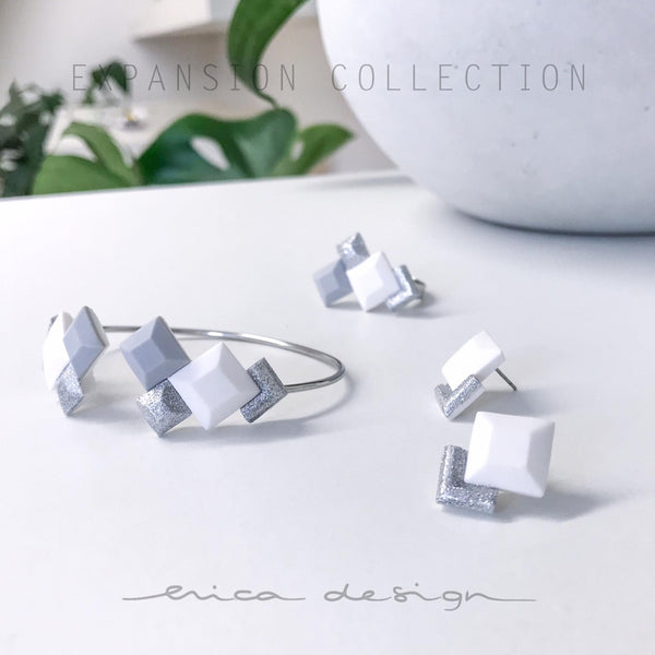 ESPANSIONE | bianco grigio argento