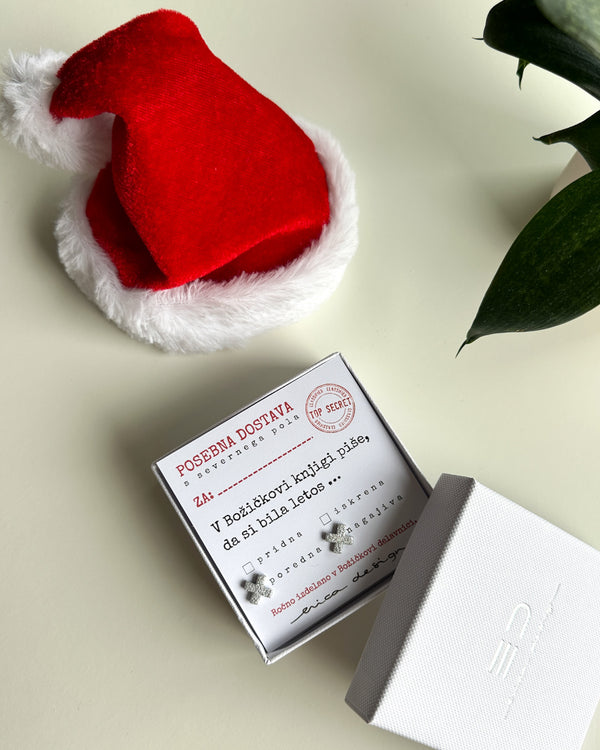 Orecchini XX su una cartolina festiva per i buoni o i cattivi