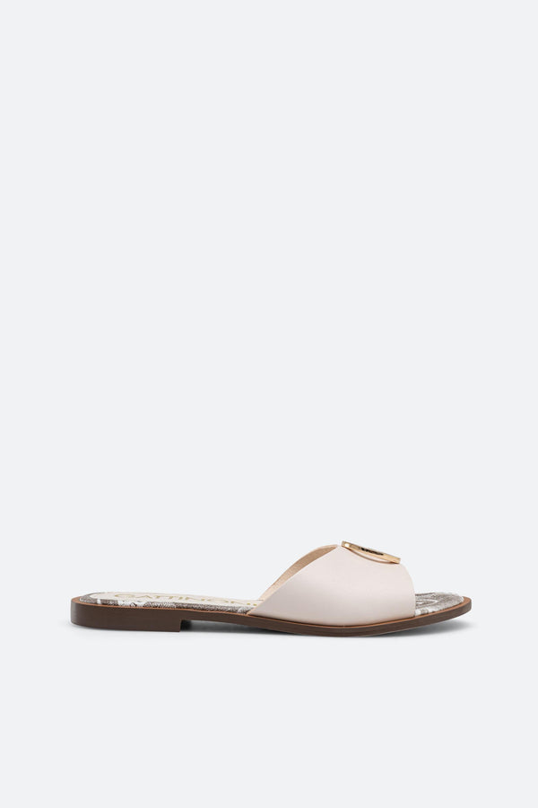 White leather slipper with plaque detail